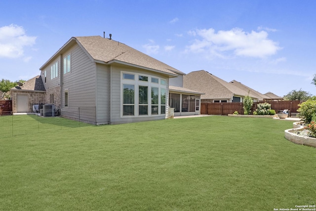8823 Hideout, San Antonio, TX 78254 - rear view of property featuring a sunroom, roof with shingles, and central AC unit