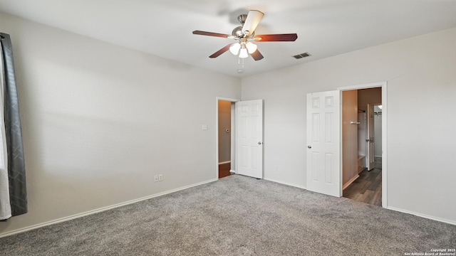 2253 Hidden Mdw, New Braunfels, TX 78130 - unfurnished bedroom featuring carpet floors, baseboards, ensuite bath, and a ceiling fan