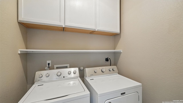 2253 Hidden Mdw, New Braunfels, TX 78130 - clothes washing area featuring washing machine and dryer, cabinet space, and a textured wall