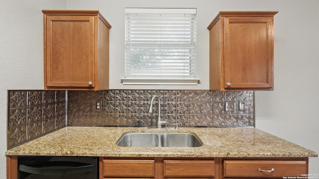 2253 Hidden Mdw, New Braunfels, TX 78130 - kitchen featuring dishwasher, a sink, backsplash, and light stone countertops