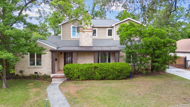 129 Elmview, Alamo Heights, TX 78209 - traditional-style house with a front yard, a chimney, and a gate