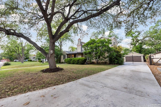 129 Elmview, Alamo Heights, TX 78209 - view of front of home with a gate, a front yard, driveway, and a chimney