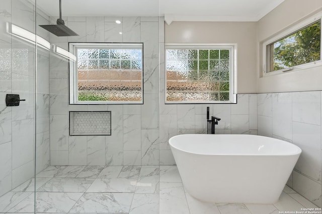 129 Elmview, Alamo Heights, TX 78209 - bathroom featuring healthy amount of natural light, a tile shower, tile walls, a freestanding tub, and marble finish flooring