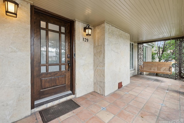 129 Elmview, Alamo Heights, TX 78209 - entrance to property with stucco siding and a porch