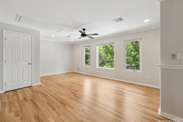 129 Elmview, Alamo Heights, TX 78209 - empty room with attic access, ceiling fan, baseboards, light wood-type flooring, and crown molding