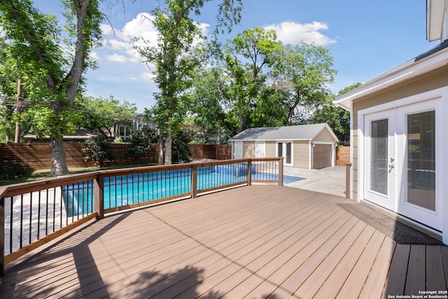 129 Elmview, Alamo Heights, TX 78209 - wooden deck with french doors, a fenced backyard, an outbuilding, and a garage