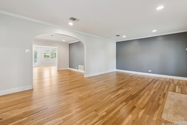 129 Elmview, Alamo Heights, TX 78209 - unfurnished room with arched walkways, light wood-type flooring, recessed lighting, baseboards, and ornamental molding