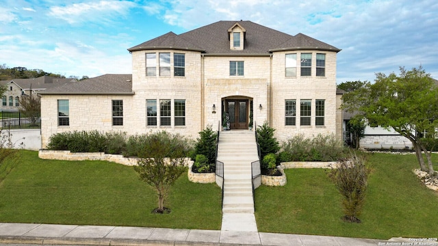 25203 Spider Rock, Boerne, TX 78006 - french provincial home with a front yard, stone siding, and french doors