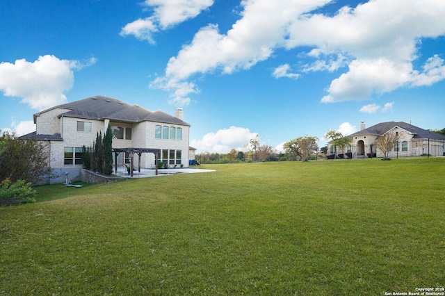 25203 Spider Rock, Boerne, TX 78006 - view of green lawn featuring a patio area and a pergola