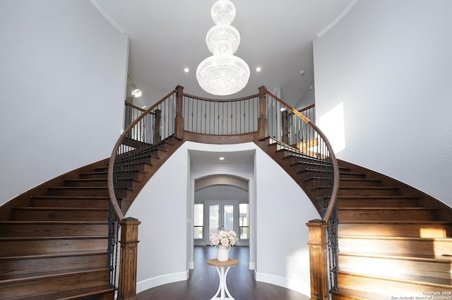 25203 Spider Rock, Boerne, TX 78006 - staircase featuring a chandelier, arched walkways, recessed lighting, a high ceiling, and wood finished floors