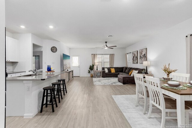6718 Carlton Crst, San Antonio, TX 78253 - dining area featuring light wood-style floors, a ceiling fan, recessed lighting, and baseboards