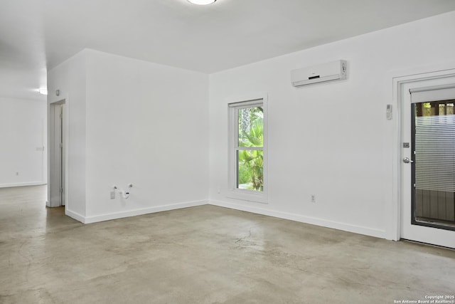 414 Clay Unit 101, & San Antonio, TX 78204 - unfurnished room with a wall unit AC, finished concrete flooring, and baseboards