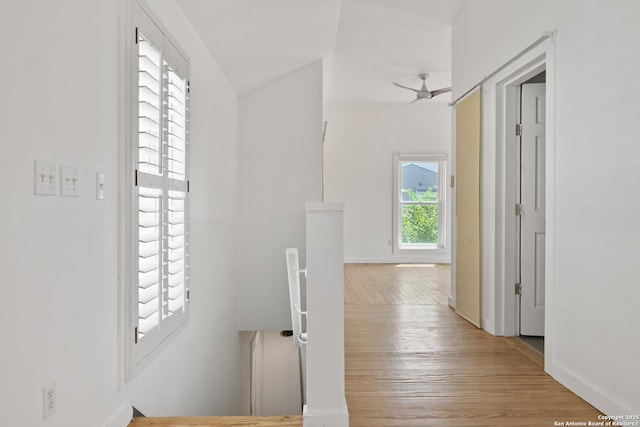 414 Clay Unit 101, & San Antonio, TX 78204 - corridor featuring light wood-style floors, baseboards, and an upstairs landing