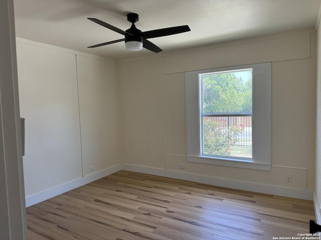 1735 W Hermine Blvd, San Antonio, TX 78201 - spare room with light wood finished floors, plenty of natural light, a ceiling fan, and baseboards
