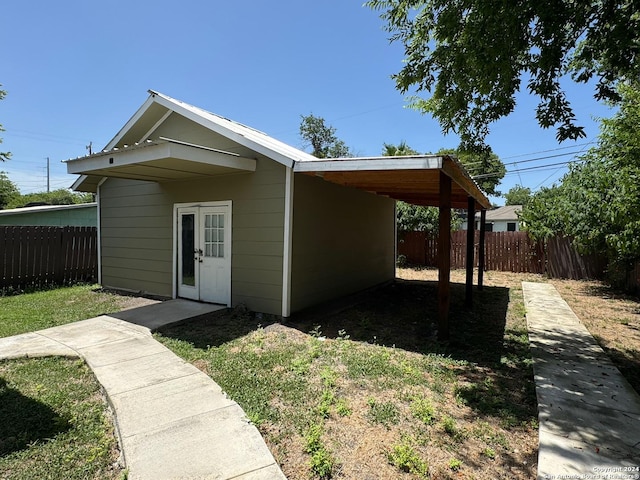 1735 W Hermine Blvd, San Antonio, TX 78201 - view of side of home featuring an attached carport