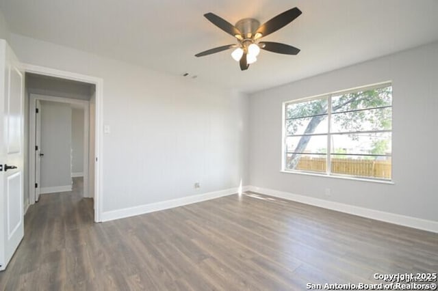 4615 Golf Vw, San Antonio, TX 78223 - unfurnished room featuring dark wood-style floors, a ceiling fan, and baseboards