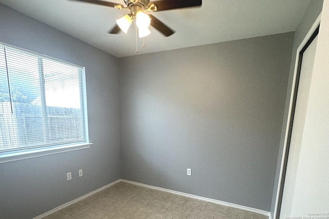 6711 Dragon Tooth, San Antonio, TX 78242 - empty room featuring ceiling fan, baseboards, and light tile patterned floors