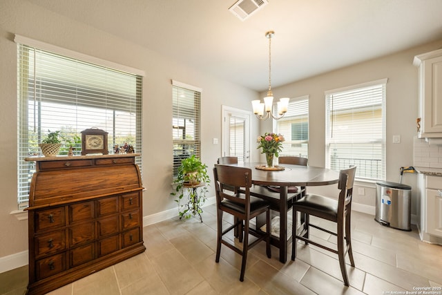 9334 Sundrop, San Antonio, TX 78254 - dining room featuring a chandelier, baseboards, and light tile patterned flooring