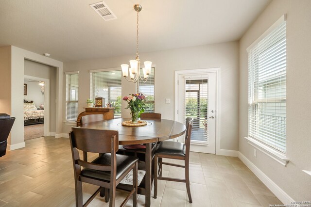 9334 Sundrop, San Antonio, TX 78254 - dining space featuring a chandelier and baseboards
