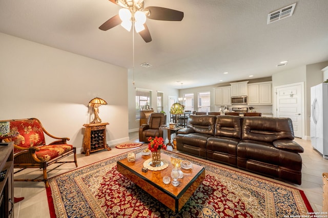 9334 Sundrop, San Antonio, TX 78254 - living area with ceiling fan, baseboards, light tile patterned floors, and recessed lighting