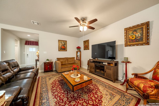 9334 Sundrop, San Antonio, TX 78254 - living room with a ceiling fan, baseboards, and light tile patterned floors
