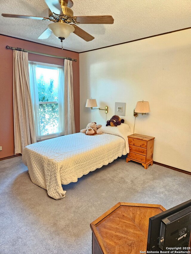 109 Cueva, Hollywood Park, TX 78232 - bedroom with carpet, a textured ceiling, a ceiling fan, and baseboards
