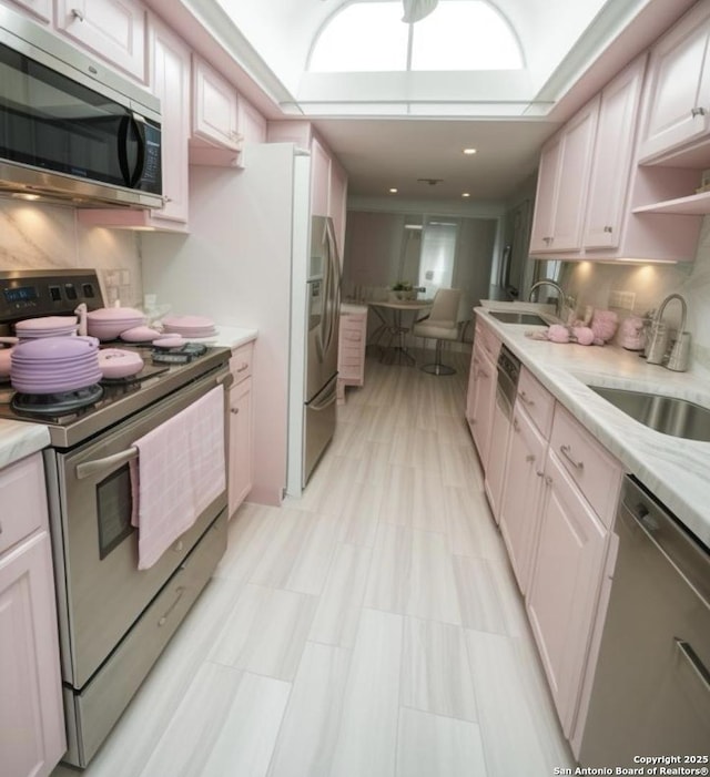 109 Cueva, Hollywood Park, TX 78232 - kitchen with appliances with stainless steel finishes, a sink, and open shelves