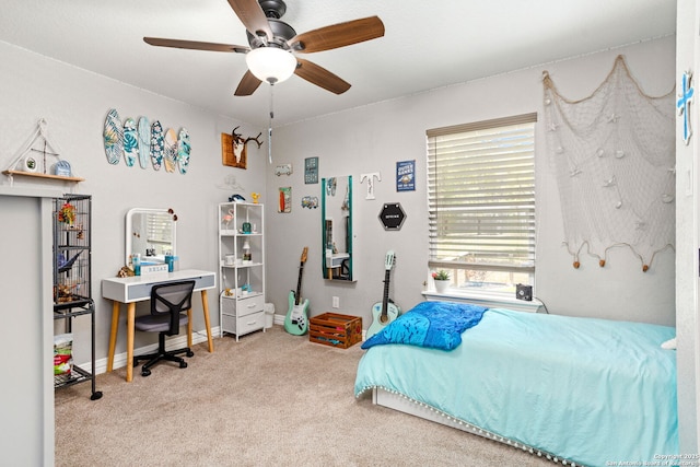 184 Great Oaks Ln, Vernia, TX 78121 - carpeted bedroom featuring a ceiling fan, baseboards, and a desk