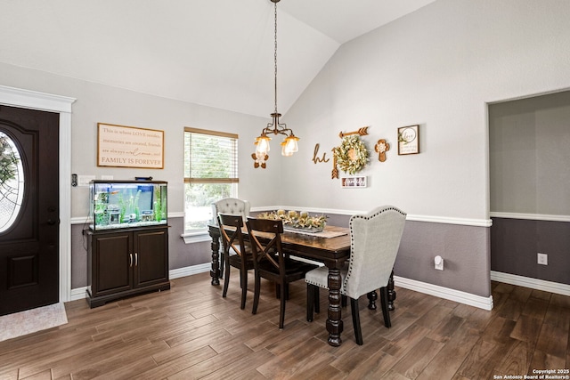 184 Great Oaks Ln, Vernia, TX 78121 - dining area with a chandelier, vaulted ceiling, wood finished floors, and baseboards