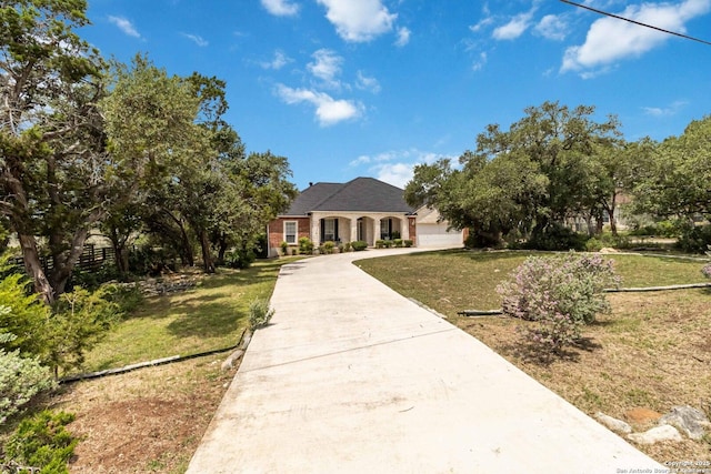573 Mountain Oaks Dr, Canyon Lake, TX 78133 - french country inspired facade with driveway, a front yard, and a garage