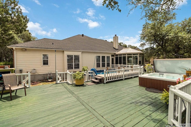 573 Mountain Oaks Dr, Canyon Lake, TX 78133 - wooden terrace featuring a covered hot tub and a sunroom