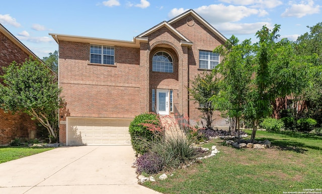 25233 Battle Lk, San Antonio, TX 78260 - traditional home featuring brick siding, concrete driveway, and a front yard