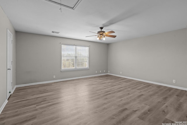 25233 Battle Lk, San Antonio, TX 78260 - unfurnished room featuring attic access, ceiling fan, wood finished floors, and baseboards