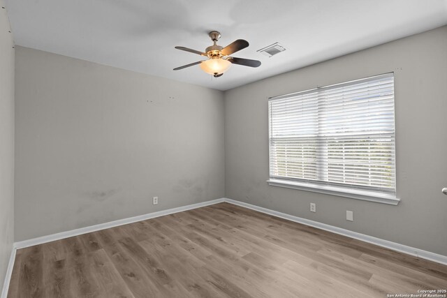 25233 Battle Lk, San Antonio, TX 78260 - spare room featuring a ceiling fan, wood finished floors, and baseboards