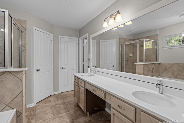 25233 Battle Lk, San Antonio, TX 78260 - bathroom with a shower stall, double vanity, a closet, and tile patterned floors