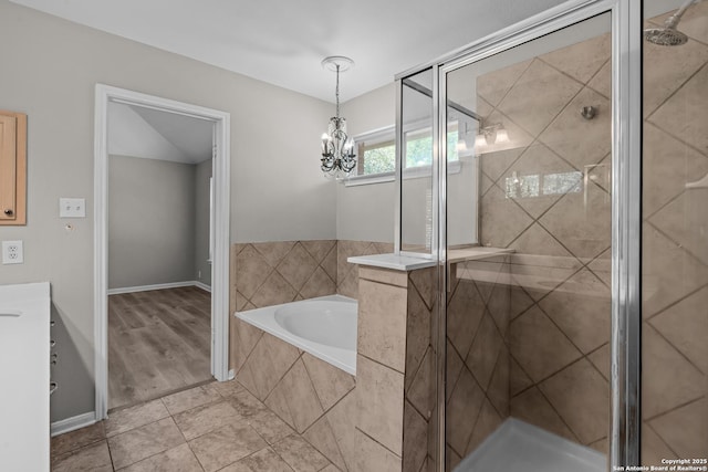 25233 Battle Lk, San Antonio, TX 78260 - full bath featuring a shower stall, a bath, and a chandelier