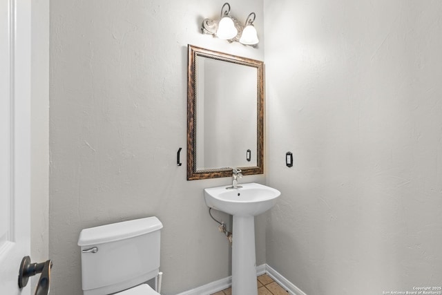 25233 Battle Lk, San Antonio, TX 78260 - bathroom with toilet and tile patterned flooring
