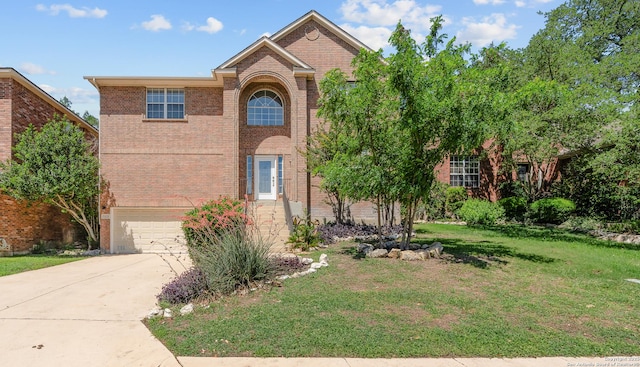 25233 Battle Lk, San Antonio, TX 78260 - traditional-style house featuring brick siding, a front lawn, a garage, and concrete driveway