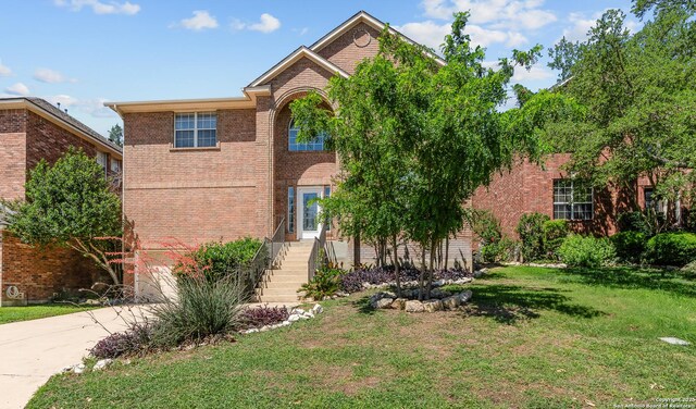 25233 Battle Lk, San Antonio, TX 78260 - traditional home with brick siding, a front lawn, driveway, and a garage
