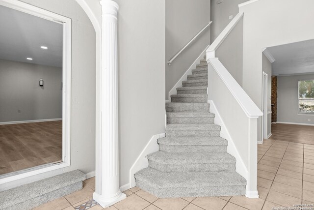 25233 Battle Lk, San Antonio, TX 78260 - stairs featuring tile patterned flooring, ornate columns, recessed lighting, and baseboards