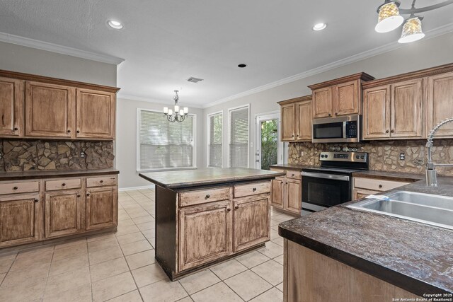 25233 Battle Lk, San Antonio, TX 78260 - kitchen featuring appliances with stainless steel finishes, dark countertops, backsplash, a chandelier, and brown cabinetry