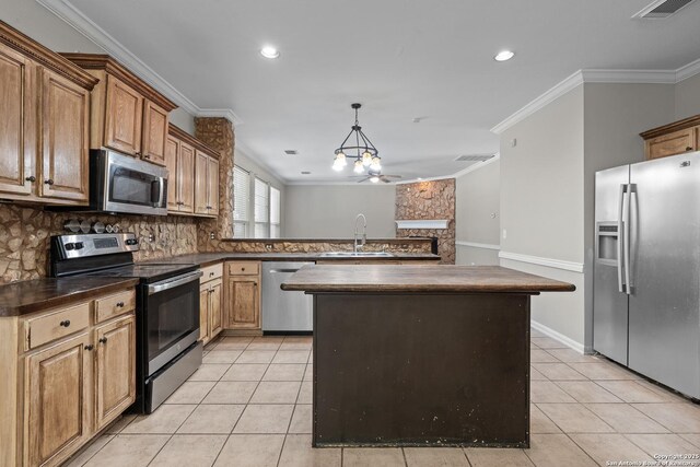 25233 Battle Lk, San Antonio, TX 78260 - kitchen featuring stainless steel appliances, a sink, dark countertops, light tile patterned flooring, and a peninsula