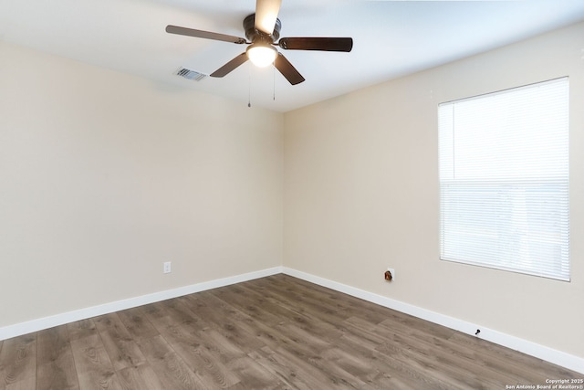 239 Surrey, San Antonio, TX 78225 - empty room with ceiling fan, wood finished floors, and baseboards