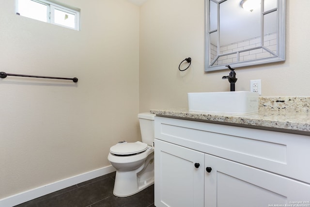 239 Surrey, San Antonio, TX 78225 - half bath featuring tile patterned floors, toilet, vanity, and baseboards