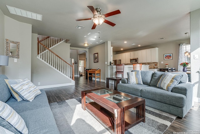 214 Ridge Blf, Cibolo, TX 78108 - living area with dark wood-type flooring, stairway, ceiling fan, arched walkways, and recessed lighting