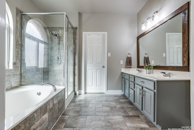 214 Ridge Blf, Cibolo, TX 78108 - full bathroom featuring a bath, a shower stall, double vanity, baseboards, and stone finish floors