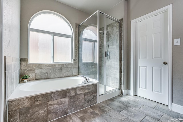 214 Ridge Blf, Cibolo, TX 78108 - full bath with healthy amount of natural light, a stall shower, and a garden tub