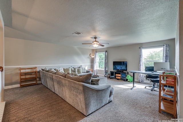 214 Ridge Blf, Cibolo, TX 78108 - living area with carpet, a desk, a ceiling fan, and a textured ceiling