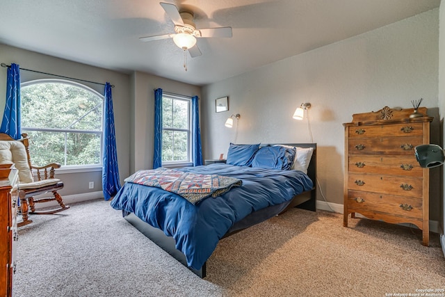 214 Ridge Blf, Cibolo, TX 78108 - bedroom with carpet, baseboards, and a ceiling fan
