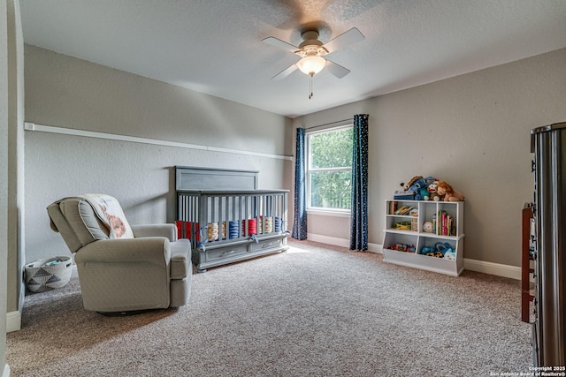 214 Ridge Blf, Cibolo, TX 78108 - carpeted bedroom with baseboards, a crib, and ceiling fan